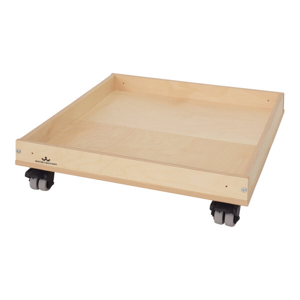 A wooden tray with wheels.