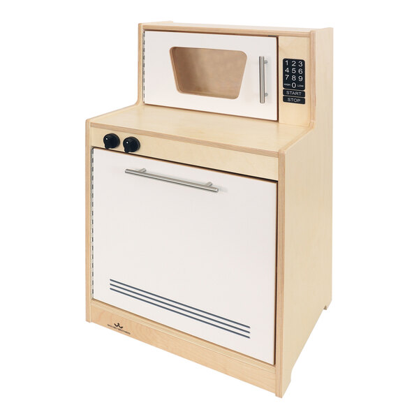 A Whitney Brothers wooden toy oven and microwave with a white door.