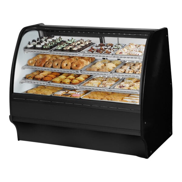 A True curved glass black dry bakery display case filled with pastries.