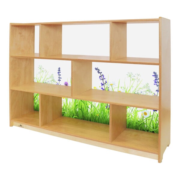 A Whitney Brothers wood cabinet with a wooden shelf featuring a nature scene.