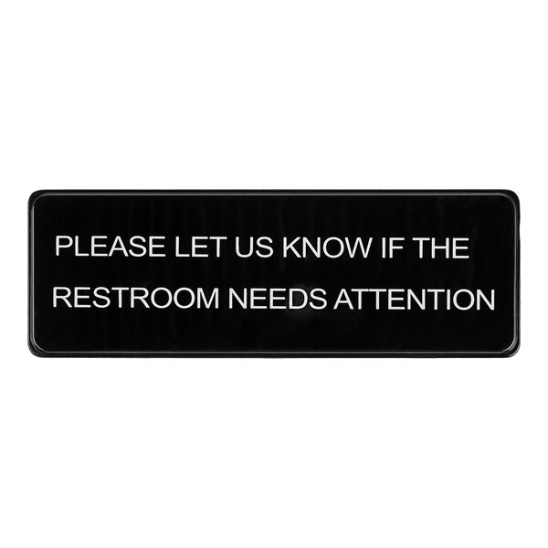 A black and white Lavex sign that says "Please Let Us Know If The Restroom Needs Attention"