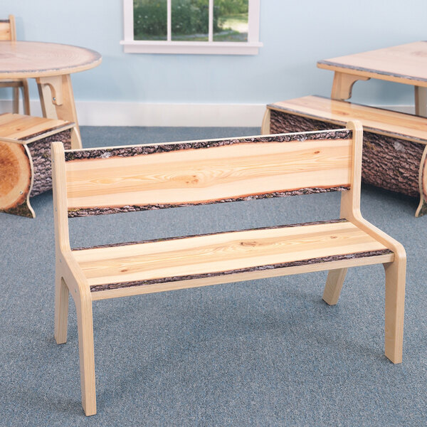 A Whitney Brothers live edge wood bench.