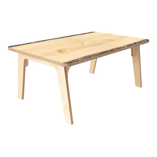 A Whitney Brothers wooden table with live edge wood top and legs.