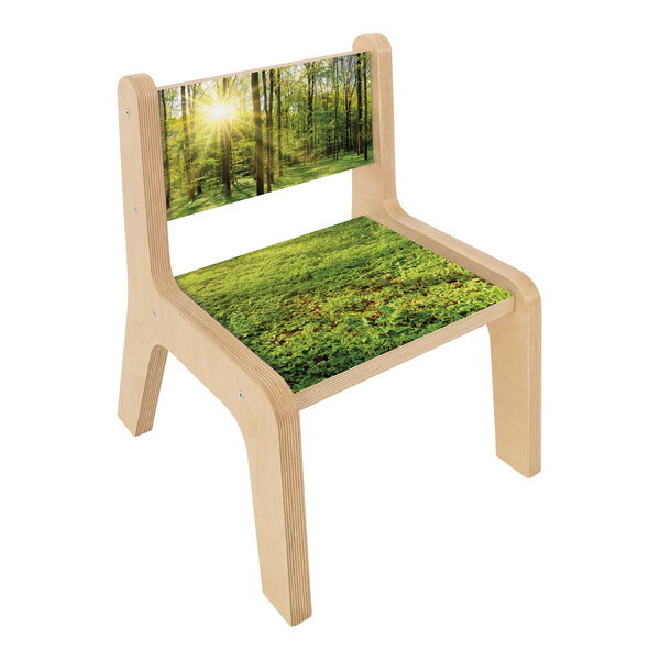 A Whitney Brothers wooden children's chair with a forest scene.