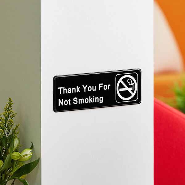 A black and white Lavex sign that says "Thank You For Not Smoking"