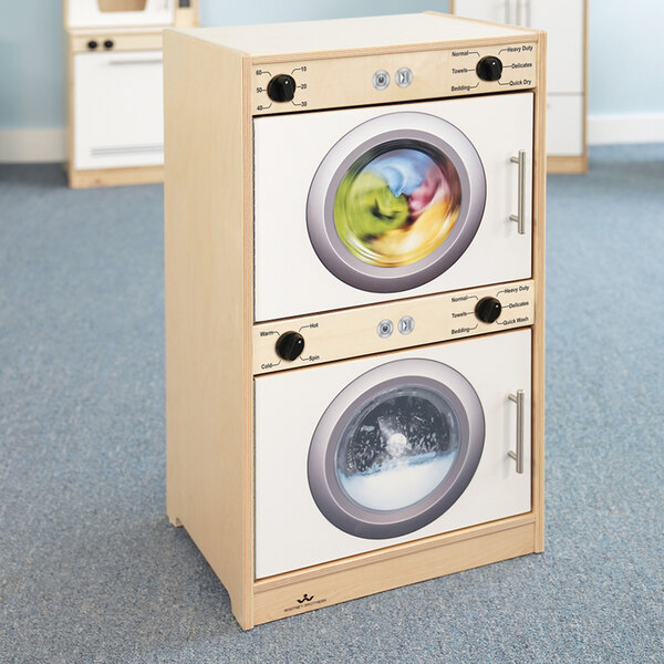 A wooden toy Whitney Brothers white washer and dryer.