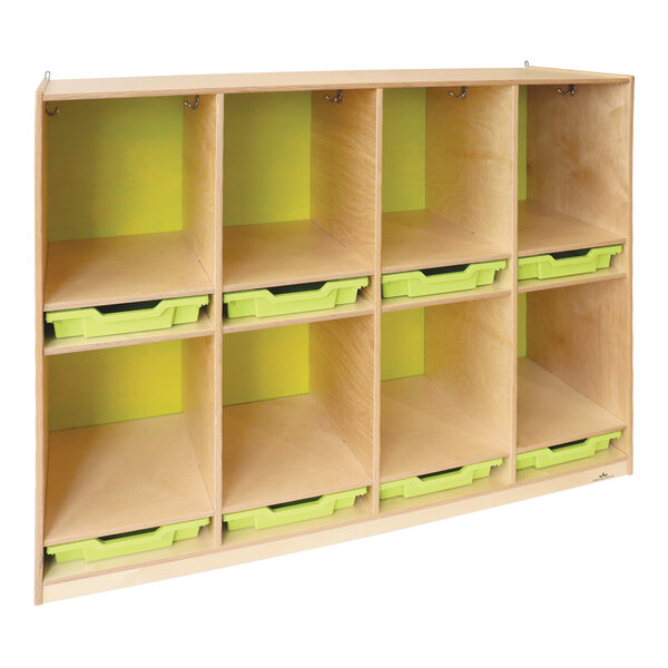 A Whitney Brothers wooden coat locker with green bins on shelves.