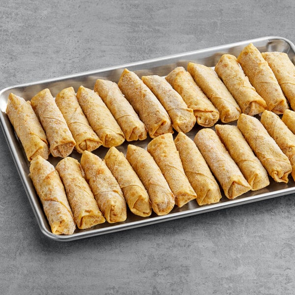 The Gourmet Egg Roll Co. Philly Cheesesteak Egg Rolls with Peppers and Onions on a tray.