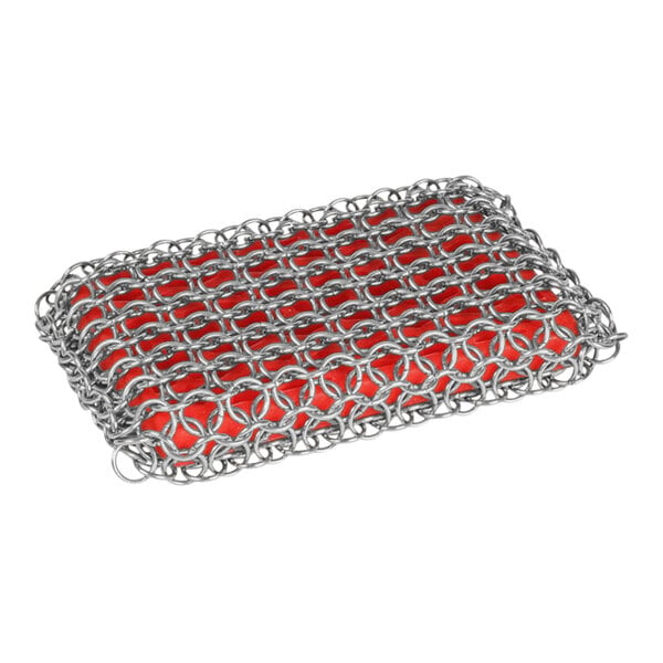 A close-up of a chain mail scrub pad with red silicone inside.