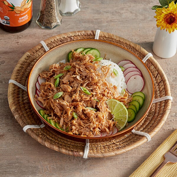 A bowl of food with Better Balance Plant-Based Vegan Shredded Meat on a table.