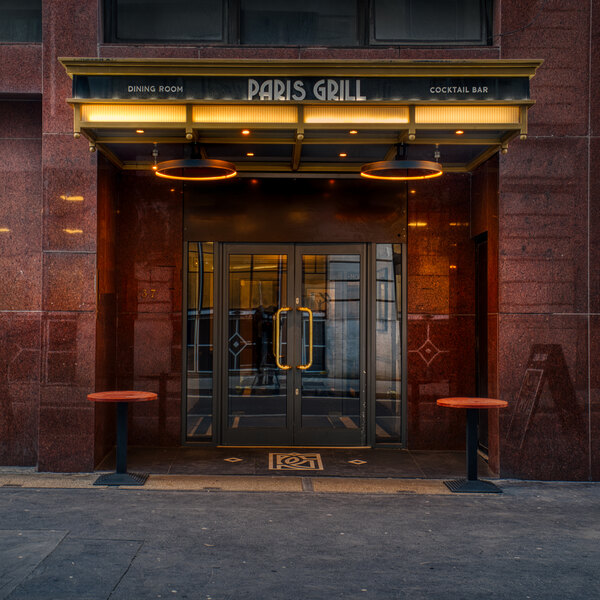 The front entrance to a steakhouse with a Bromic Heating matte black patio heater.