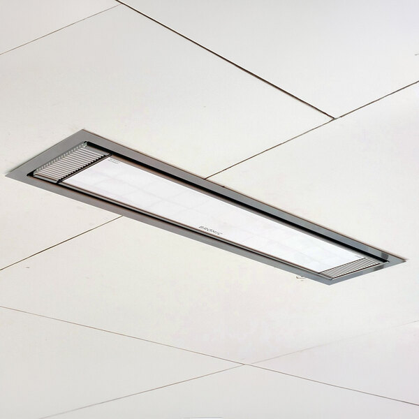A rectangular white electric outdoor patio heater installed in a ceiling panel.