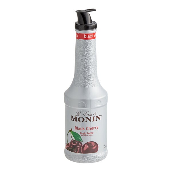 A white Monin bottle of Black Cherry Fruit Puree with a black lid.