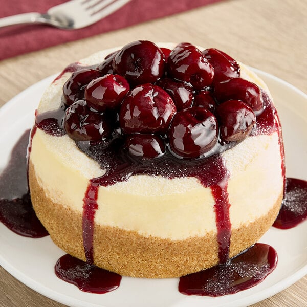 A cheesecake with Monin Black Cherry Fruit Puree on top.
