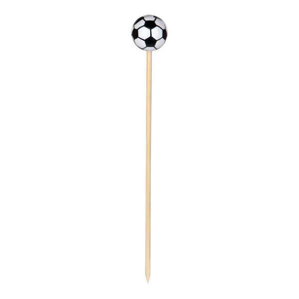 A soccer ball-shaped toothpick on a stick.