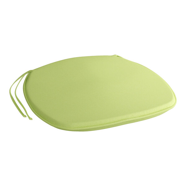 A green chair and bar stool cushion with ties.