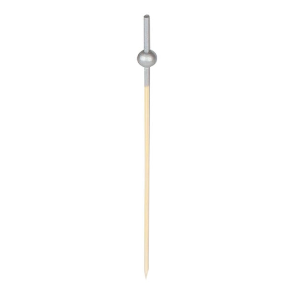 A wooden toothpick with a beaded ball on top.