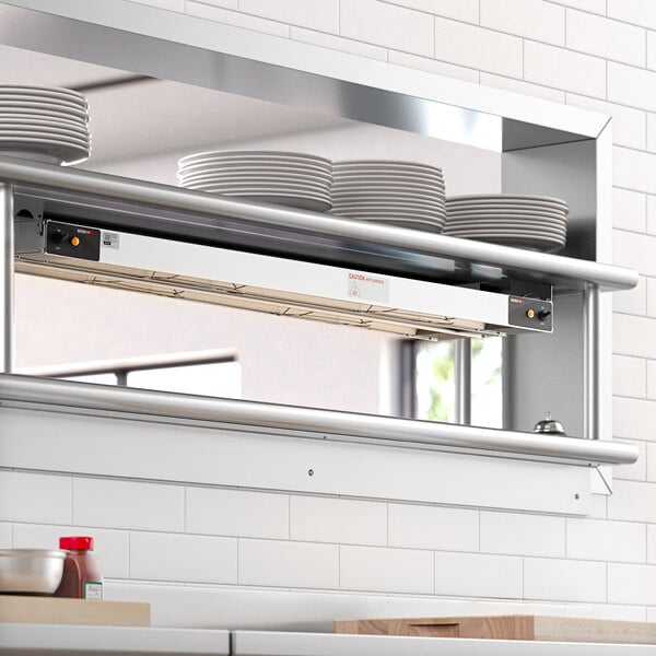 A ServIt double strip warmer on a counter in a professional kitchen.