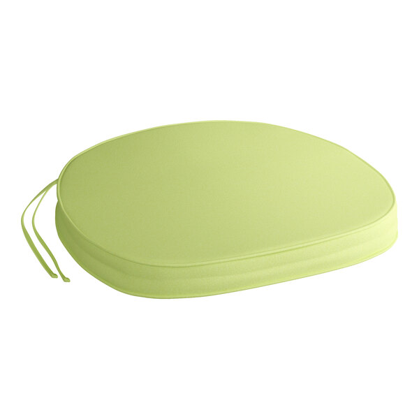 A Lancaster Table & Seating Vineyard Series Vine Green chair and bar stool cushion with ties on a green chair.