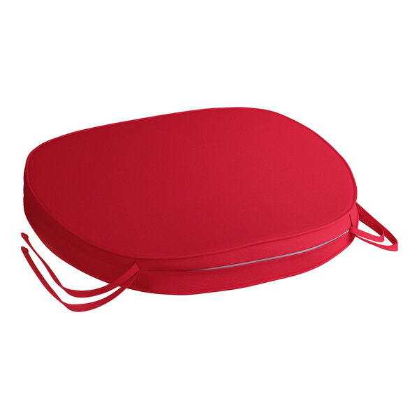 A red Lancaster Table & Seating chair cushion with ties.