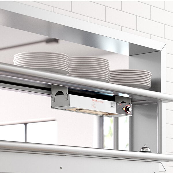 A ServIt strip warmer with a plate of food on it.