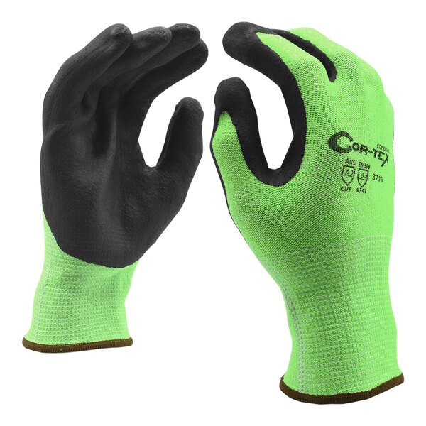 A close-up of a pair of green Cordova warehouse gloves with black foam nitrile palm coating.