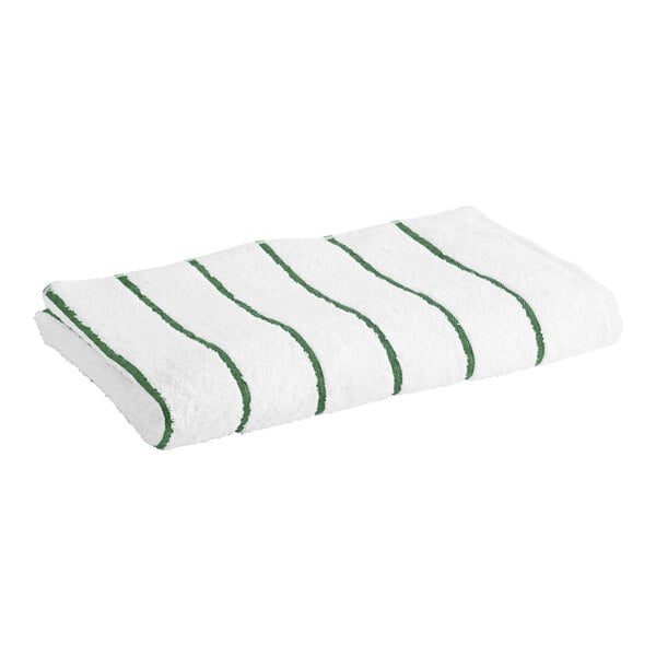 A white Garnier-Thiebaut pool towel with green stripes.