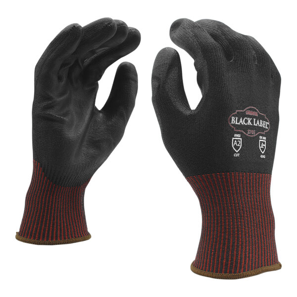 A pair of large Cordova black cut-resistant gloves with black polyurethane palms and a red stripe.