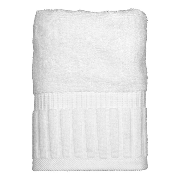 A folded white Garnier-Thiebaut hand towel with a white band.