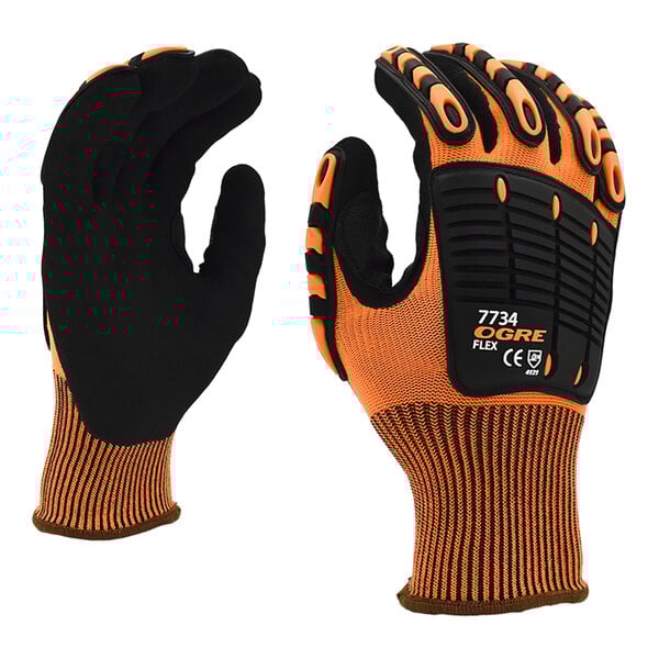 A close up of a black Cordova OGRE-Flex work glove with orange accents.