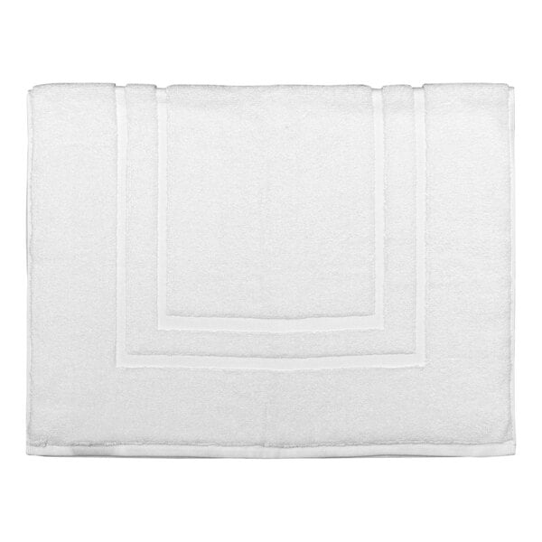 A white terry cotton bath mat with a square dobby border.