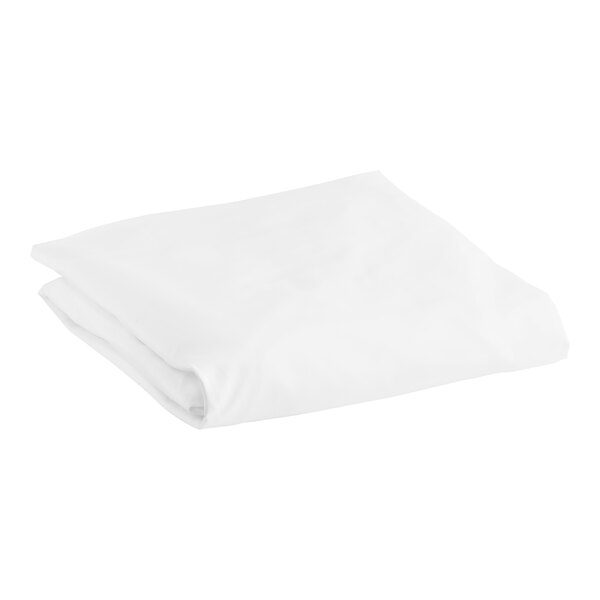 A folded white Garnier-Thiebaut king size fitted sheet.