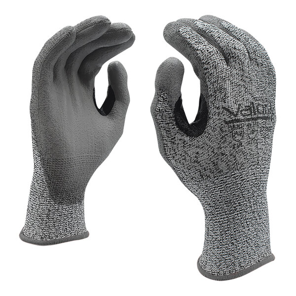 A pair of Cordova gray gloves with gray polyurethane palms on a white background.