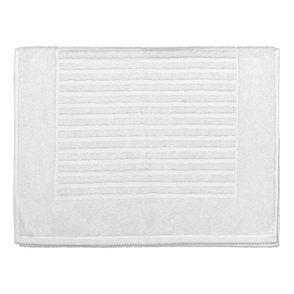 A white bath mat with lines on it.