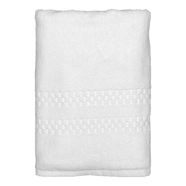 A white Garnier-Thiebaut bath towel with a stitched edge.