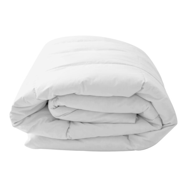 A folded white Garnier-Thiebaut cotton duvet insert.