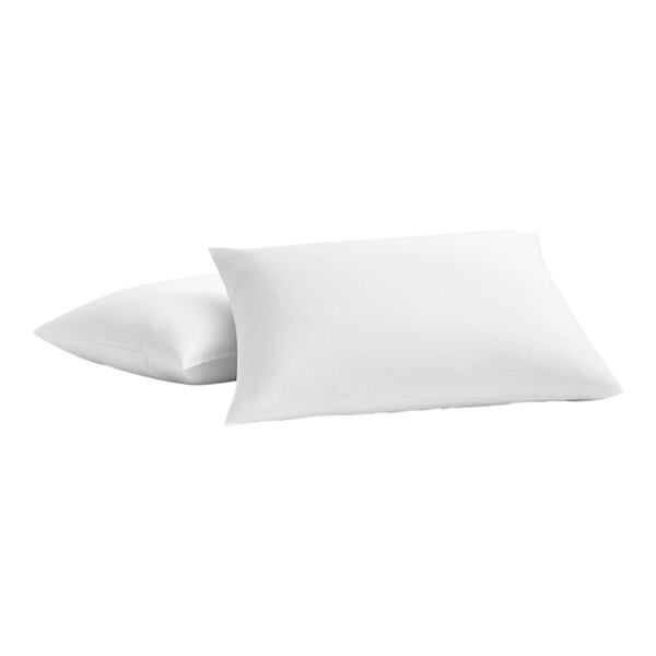 Two white Garnier-Thiebaut percale weave pillowcases on white pillows.