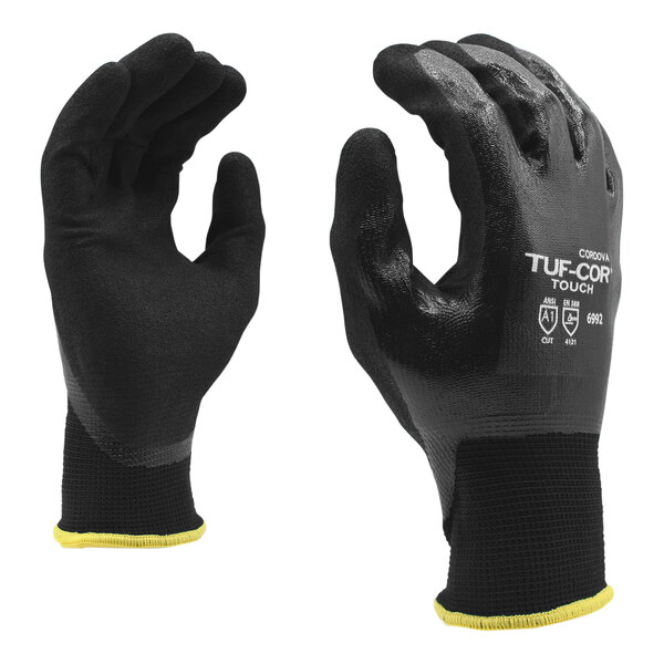 A pair of black Cordova Tuf-Cor Touch gloves with yellow fingertips.