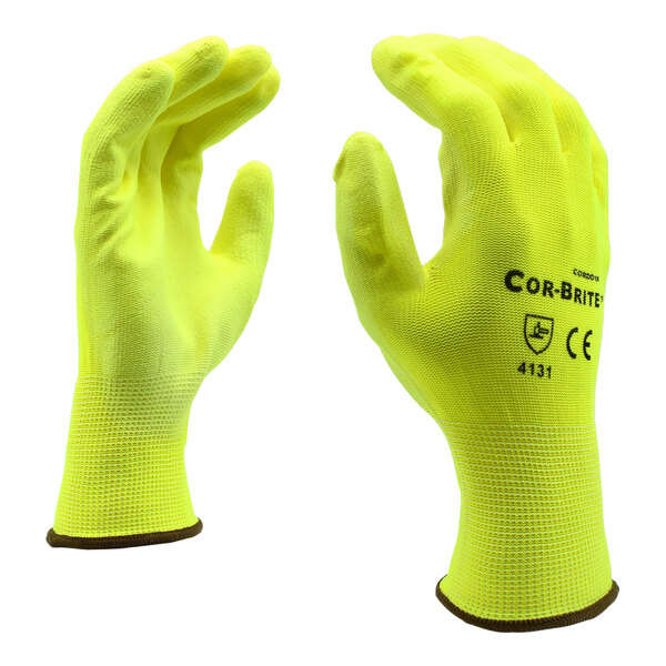 A close-up of a pair of yellow Cordova warehouse gloves with yellow polyurethane palm coating.