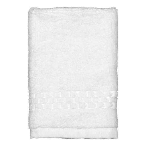 A white Garnier-Thiebaut terry wash cloth with a pattern.