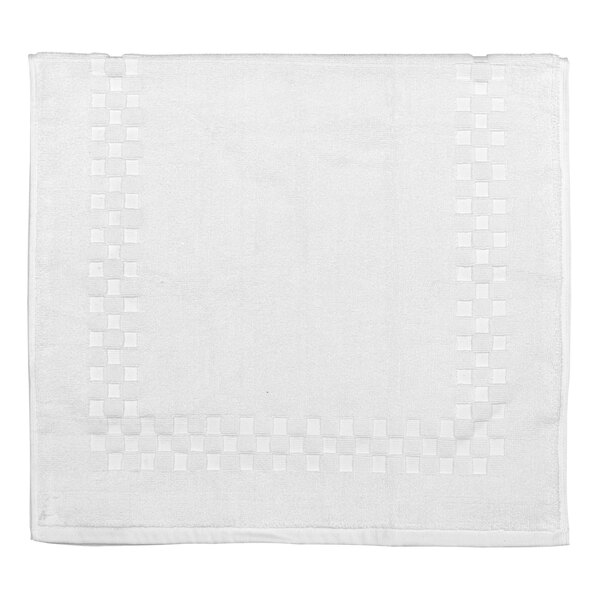 A white bath mat with a checkered border.