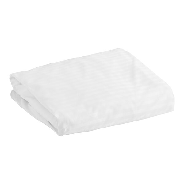 A folded white Garnier-Thiebaut Cambridge queen size fitted sheet.