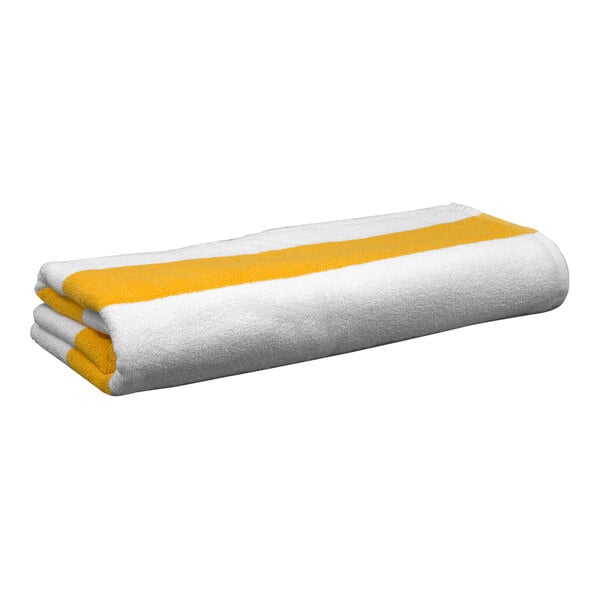 A folded white towel with yellow stripes.