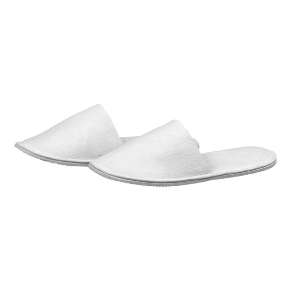 A pair of white Garnier-Thiebaut slippers.