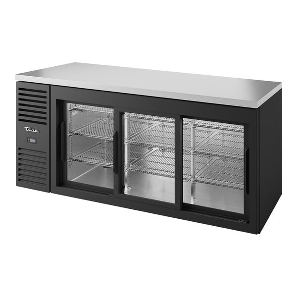 A black True back bar refrigerator with glass doors.