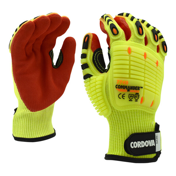 A pair of yellow Cordova Commander heavy duty work gloves with red accents and a red sandy palm coating.