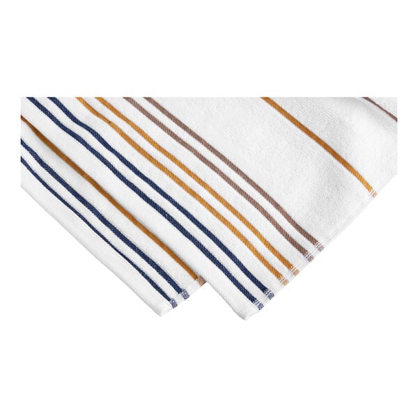 A white Garnier-Thiebaut pool towel with orange and blue stripes.