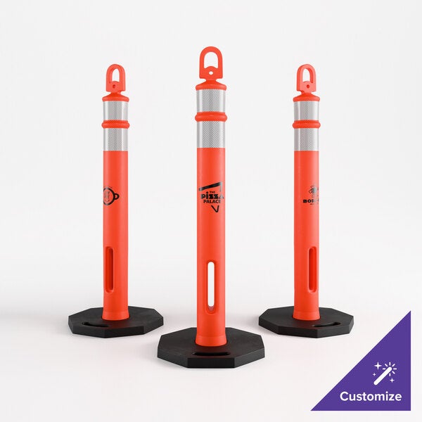 A set of three orange ring top delineator posts with reflective bands and black hexagonal bases.