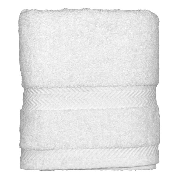 A folded white Garnier-Thiebaut hand towel on a white surface.