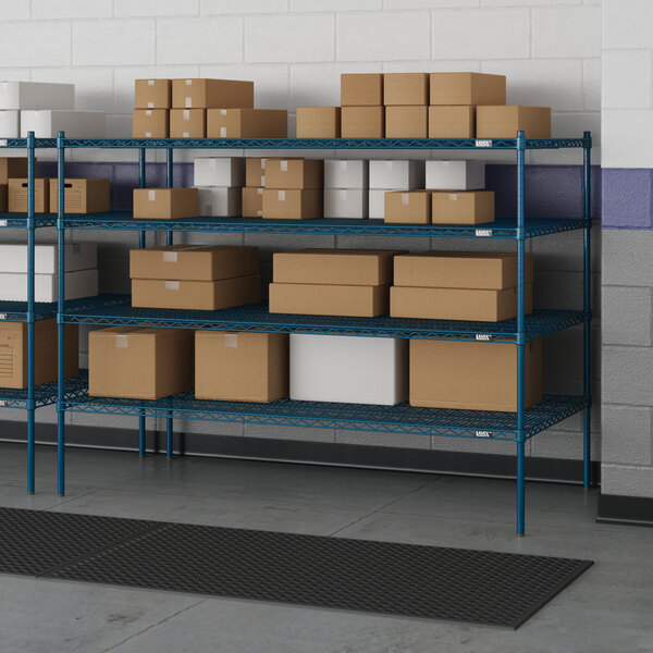 A Lavex Pro blue wire shelving unit with boxes on the shelves.